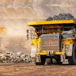 Open pit mine industry, big yellow mining truck for coal