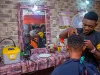 Barber using a Lumos Box