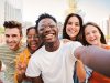 Group of young people smiling and taking a selfie together - bp Ghana